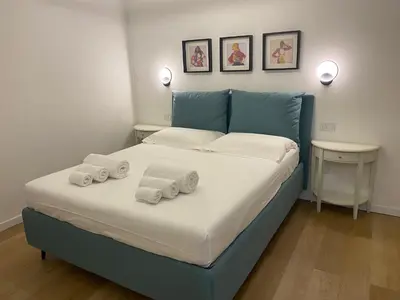 Letto o letti in una camera di Palazzo Cavour Rooms & Breakfast