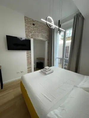 Letto o letti in una camera di Palazzo Cavour Rooms & Breakfast