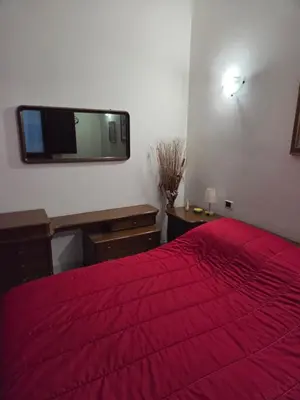 Letto o letti in una camera di Casa Andrea