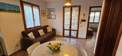 Area soggiorno di Casa Spiga - Solanas, near the beach