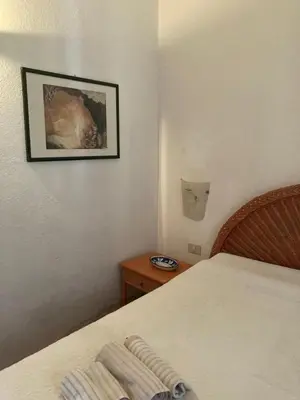 Letto o letti in una camera di Villa Roberta