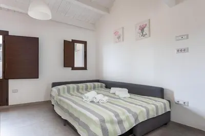 Letto o letti in una camera di Il Sole di Cabras-Modern apt in the Heart of Town
