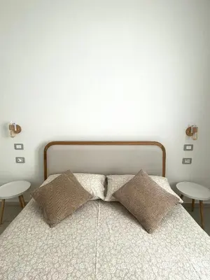 Letto o letti in una camera di Domus Apartments