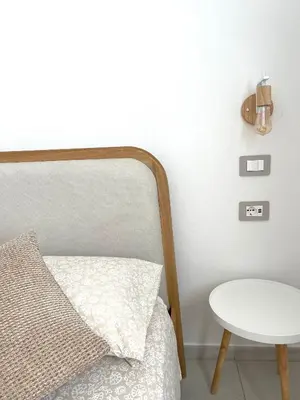 Letto o letti in una camera di Domus Apartments