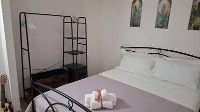 Letto o letti in una camera di Cagliari Charme