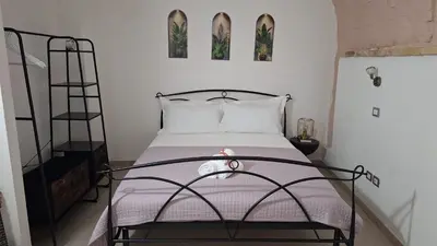 Letto o letti in una camera di Cagliari Charme