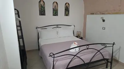 Letto o letti in una camera di Cagliari Charme