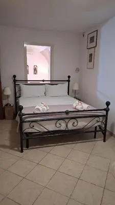 Letto o letti in una camera di Cagliari Charme