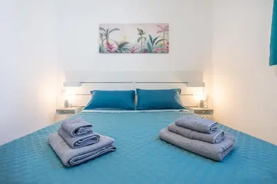 Letto o letti in una camera di Casa Anna