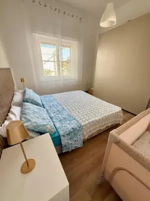 Letto o letti in una camera di Casa Rosmarino