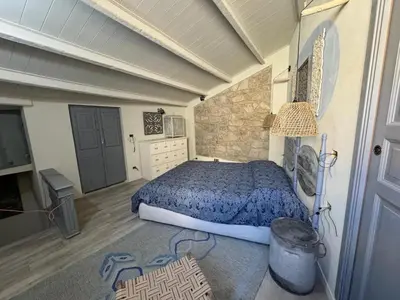 Letto o letti in una camera di Tuna house