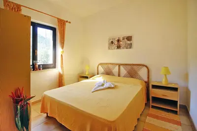 Letto o letti in una camera di Apartment on Costa Rei near White Beaches