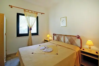 Letto o letti in una camera di Apartment on Costa Rei near White Beaches