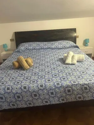 Letto o letti in una camera di Villa Margherita