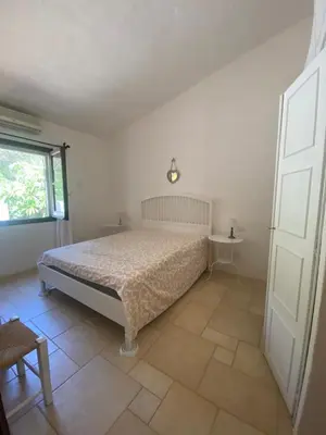 Letto o letti in una camera di Villa Meigama - Porto Giunco