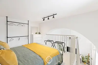 Letto o letti in una camera di 24 Via Giardini
