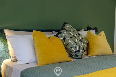Letto o letti in una camera di 24 Via Giardini