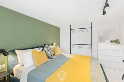 Letto o letti in una camera di 24 Via Giardini