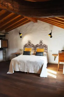 Letto o letti in una camera di La pietra nel borgo