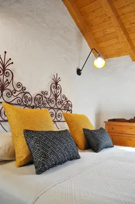 Letto o letti in una camera di La pietra nel borgo