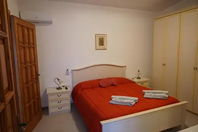 Letto o letti in una camera di Molentargius Domus