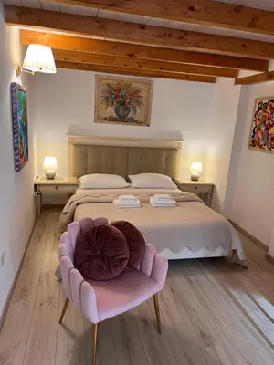 Letto o letti in una camera di Affittacamere Louis