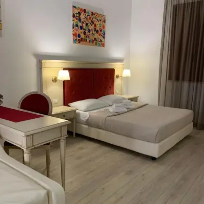 Letto o letti in una camera di Affittacamere Louis