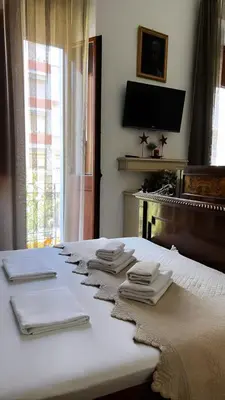 Letto o letti in una camera di Affittacamere Louis