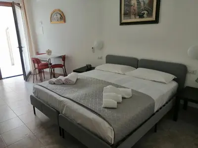 Letto o letti in una camera di CASA VACANZE gli ULIVI 23