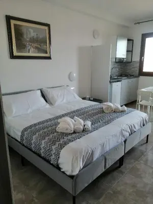 Letto o letti in una camera di CASA VACANZE gli ULIVI 23