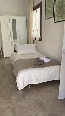 Letto o letti in una camera di CASA VACANZE gli ULIVI 23
