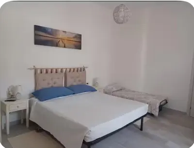 Letto o letti in una camera di Casa Claudia