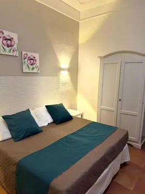 Letto o letti in una camera di La Mimosa