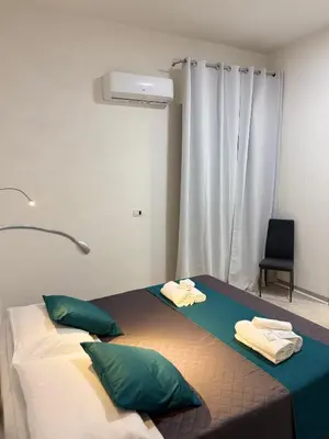Letto o letti in una camera di La Mimosa