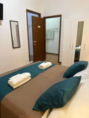 Letto o letti in una camera di La Mimosa