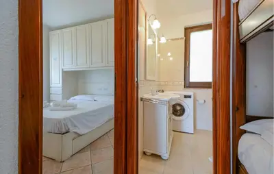 Letto o letti in una camera di 1 Bedroom Beautiful Home In Costa Rei