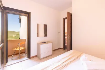 Letto o letti in una camera di Il terrazzo sulla duna 4 Torre dei Corsari