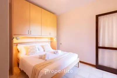 Letto o letti in una camera di Il terrazzo sulla duna 4 Torre dei Corsari