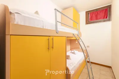 Letto o letti in una camera di Il terrazzo sulla duna 4 Torre dei Corsari