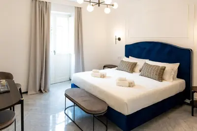 Letto o letti in una camera di Marmori Suites Cagliari