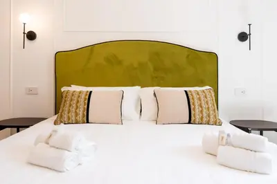 Letto o letti in una camera di Marmori Suites Cagliari