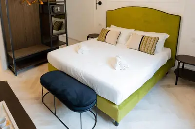 Letto o letti in una camera di Marmori Suites Cagliari
