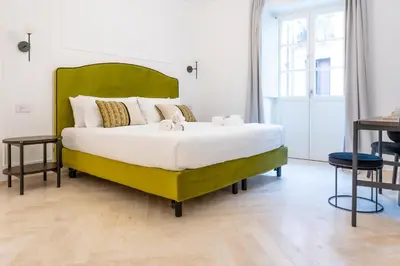 Letto o letti in una camera di Marmori Suites Cagliari