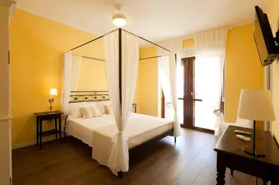 Letto o letti in una camera di La Tuia e il Tasso