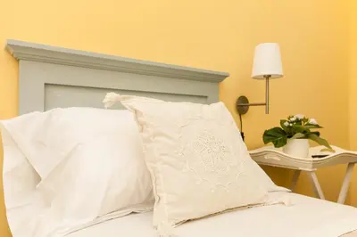 Letto o letti in una camera di La Tuia e il Tasso