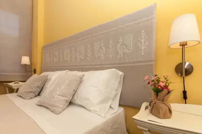 Letto o letti in una camera di La Tuia e il Tasso