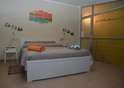 Letto o letti in una camera di B&B Annalu'
