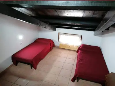 Letto o letti in una camera di Casa vacanza Is Argiolas