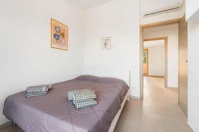 Letto o letti in una camera di Villa Rosa