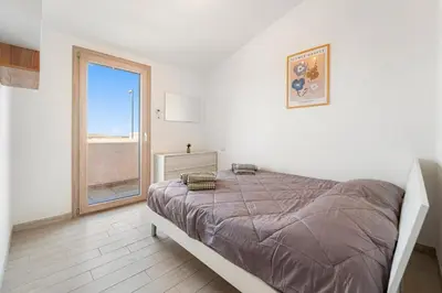 Letto o letti in una camera di Villa Rosa